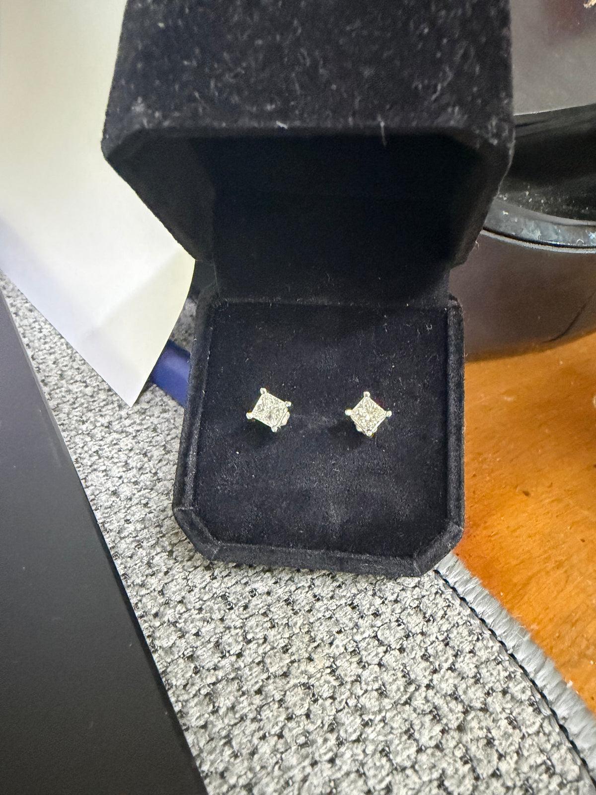 Pair of platinum princess-cut 1ctw natural diamond screw-back earrings displayed in a jewelry box