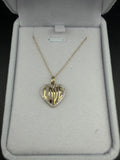 Yellow gold heart pendant with LOVE lettering and a diamond border, shown with a chain in a jewelry box